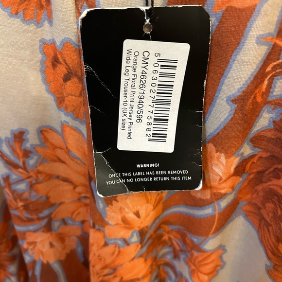 NWT- PrettyLittleThing orange floral print wide-leg pants. - Picture 5 of 8